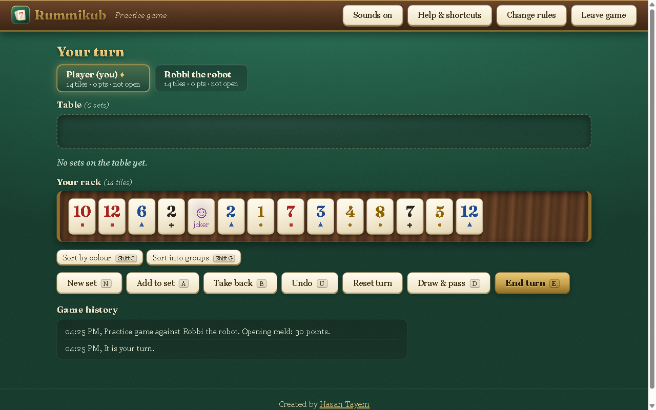 An Accessible Rummikub practice game, with a rack of numbered tiles on a wooden rail above a green felt table and keyboard shortcut labels on the New set, Add to set and End turn buttons.